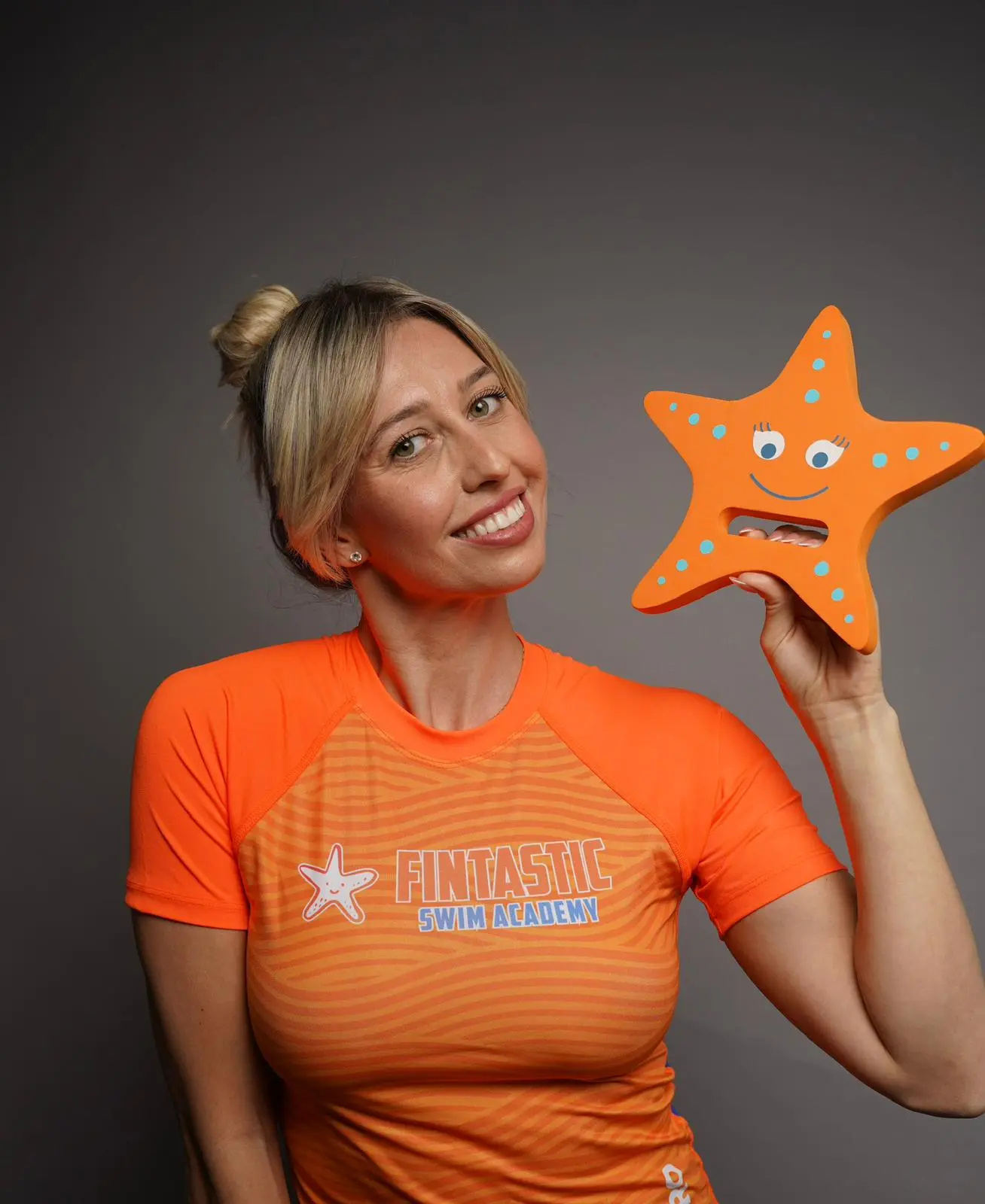 Fintastic Promo - Short Fintastic Promo - Woman holding starfish floatie